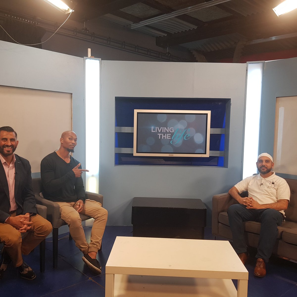Guests seated on the set of the television programme Living the Life